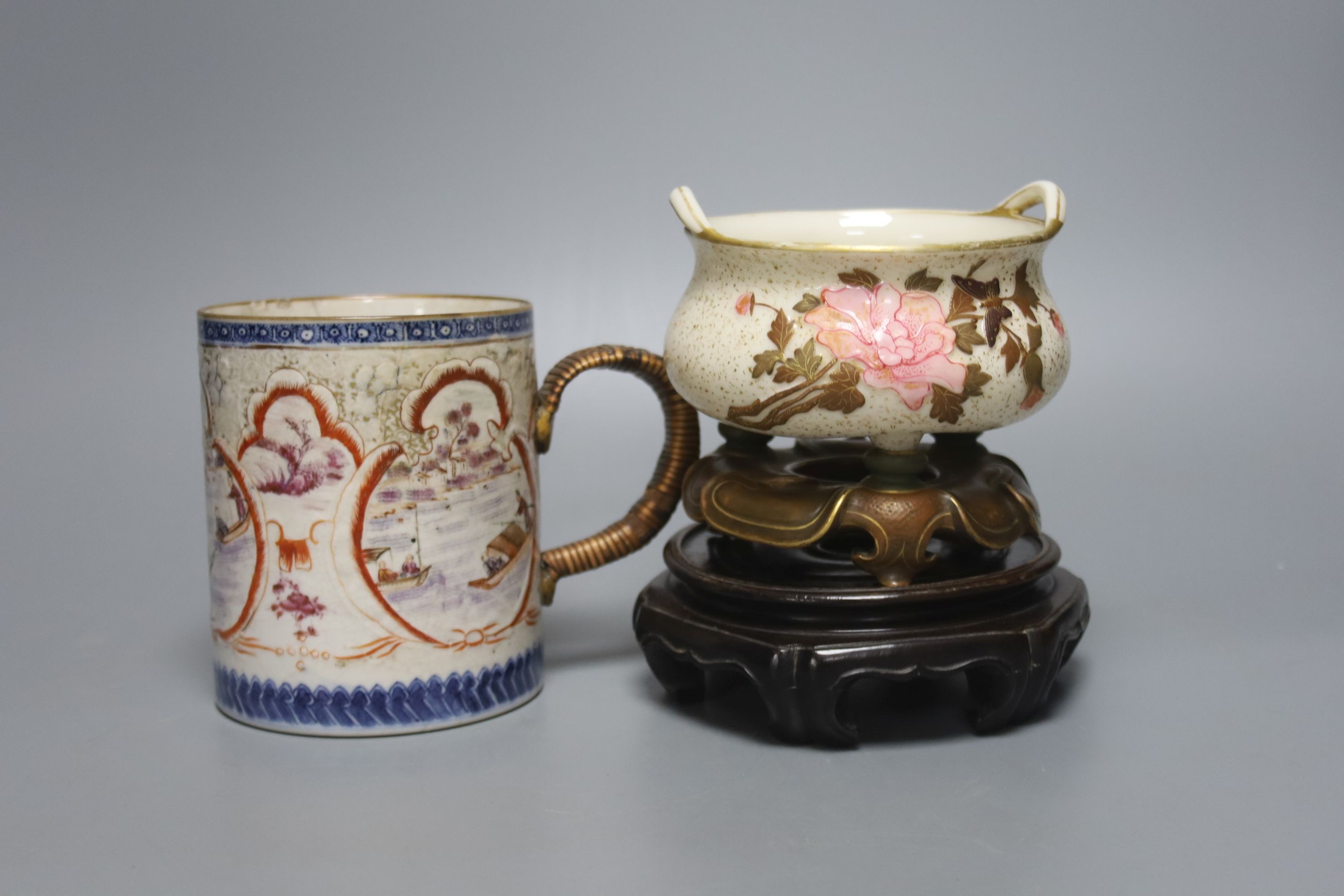 A Royal Worcester chinoiserie incense burner and integral stand, late 19th century, 11.5cmwide, wood stand and an 18th century Chinese export rose famille mug, with later metal handle